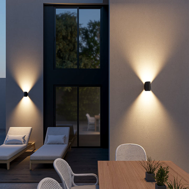"LED up down black wall sconce light with sleek design for indoor and outdoor use, IP65 waterproof, energy-efficient LED."