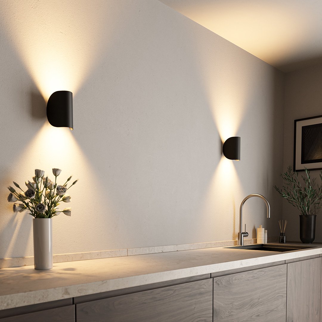 "LED up down black wall sconce light with sleek design for indoor and outdoor use, IP65 waterproof, energy-efficient LED."