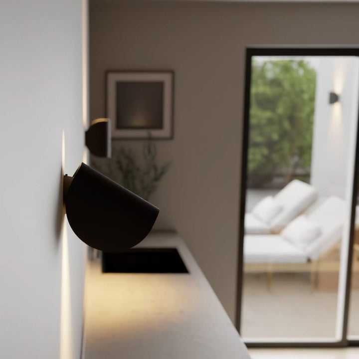 "LED up down black wall sconce light with sleek design for indoor and outdoor use, IP65 waterproof, energy-efficient LED."