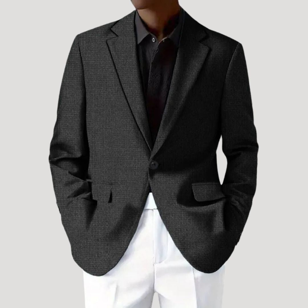Close-up of the light blue textured fabric on a men's tailored blazer