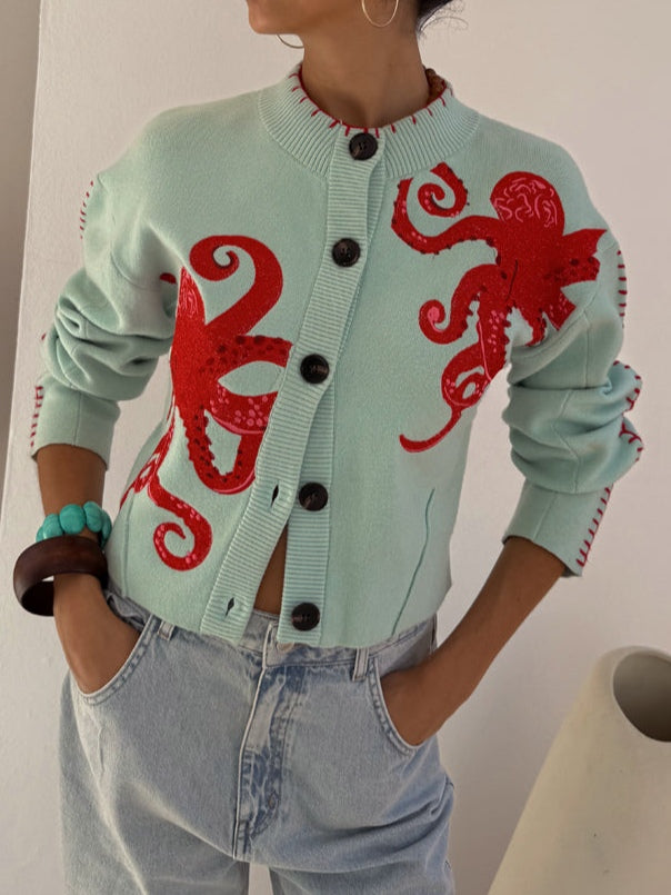 Light blue women's knit cardigan with unique octopus pattern, button front.