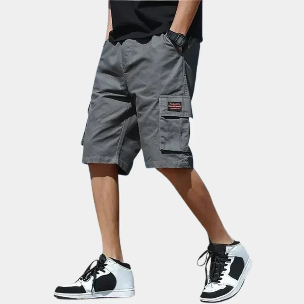 Relaxed fit men's cotton cargo shorts, ideal for warm weather travel and casual outdoor wear.