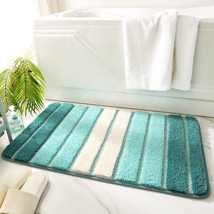 Cloud-soft organic weave bath rug in leaf green. Plush microfiber floor mat for luxurious bathroom decor.