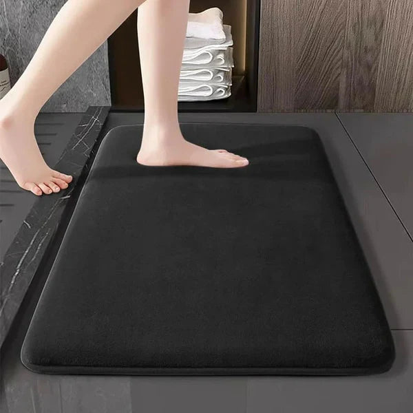 "Luxurious velvet bath mat with memory foam, anti-slip backing, plush coral surface, available in assorted colors and sizes."