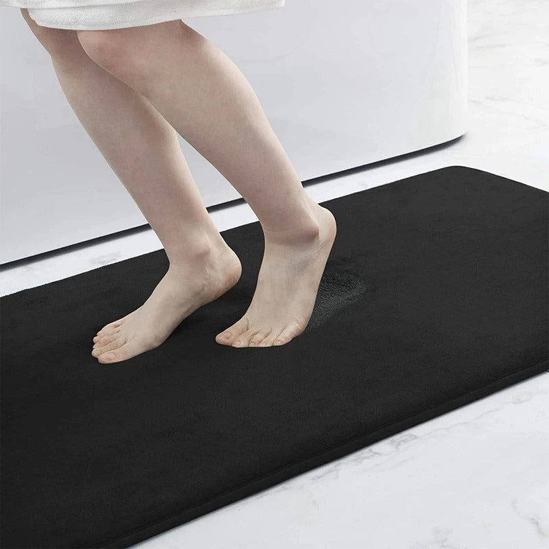 "Luxurious velvet bath mat with memory foam, anti-slip backing, plush coral surface, available in assorted colors and sizes."