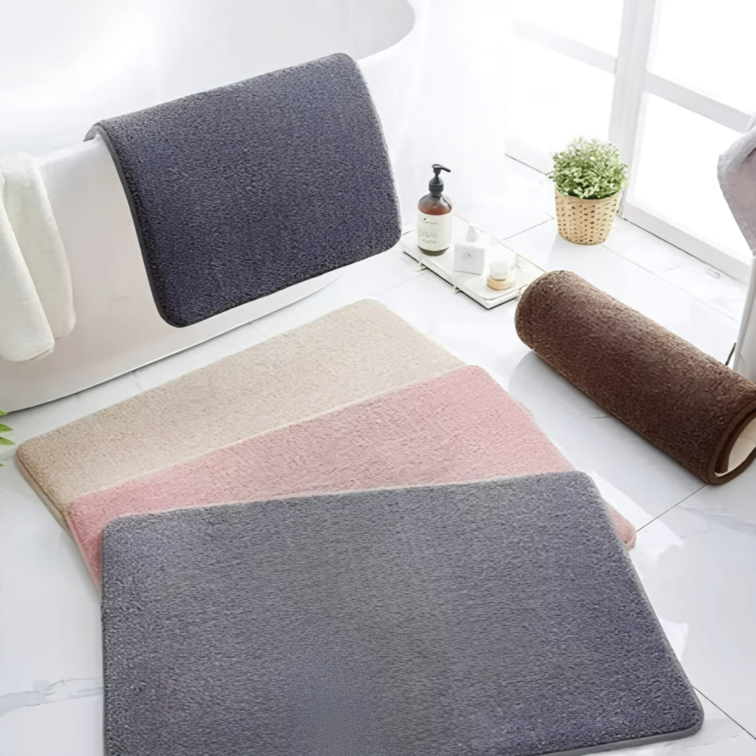 "Luxurious velvet bath mat with memory foam, anti-slip backing, plush coral surface, available in assorted colors and sizes."