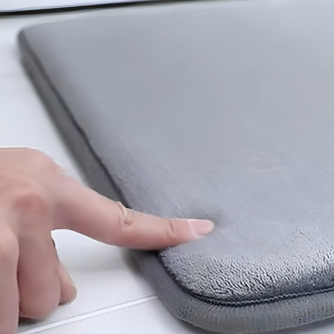 "Luxurious velvet bath mat with memory foam, anti-slip backing, plush coral surface, available in assorted colors and sizes."