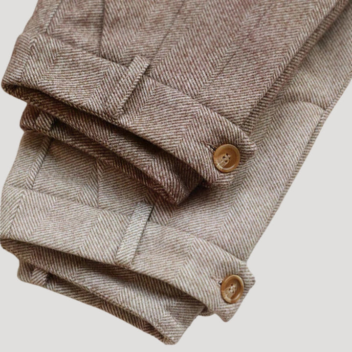 Close-up of the fabric texture of men's tailored ankle-length pants, showing quality craftsmanship.