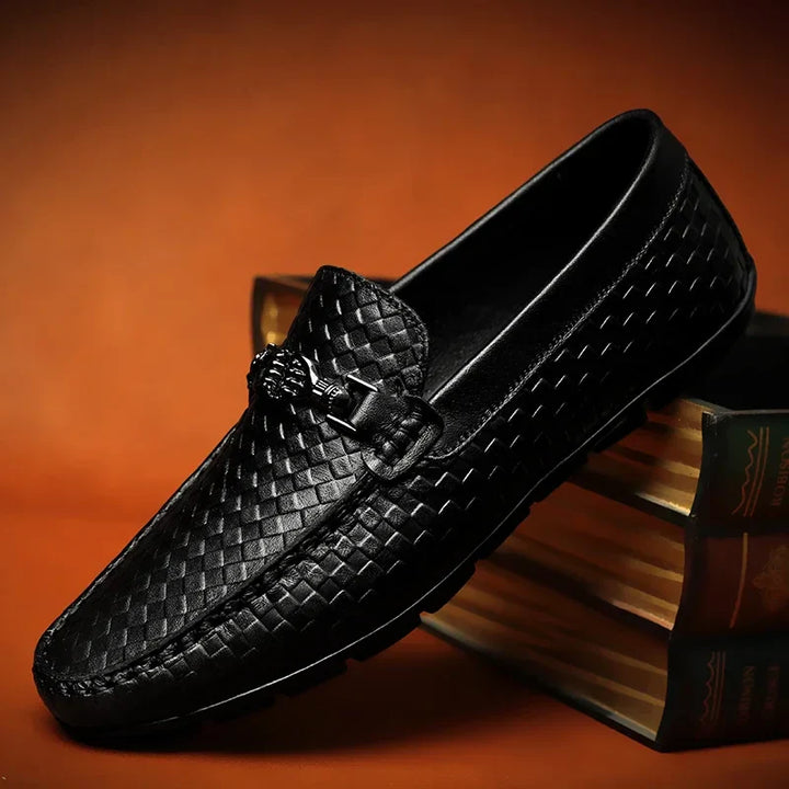 Close-up of the vamp of a white men's grip loafer, emphasizing the clean, slip-on design