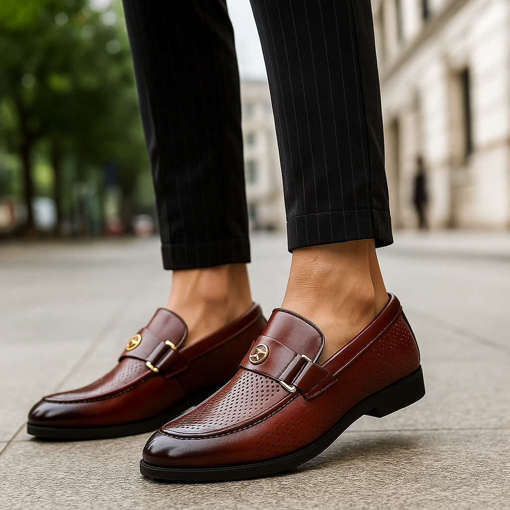 Stylish men's perforated loafers in a neutral taupe, versatile for both casual and travel use.