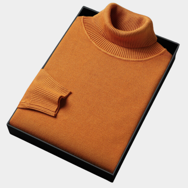 Close-up of knit fabric on a men's long sleeve turtleneck sweater, showcasing bold color and texture.