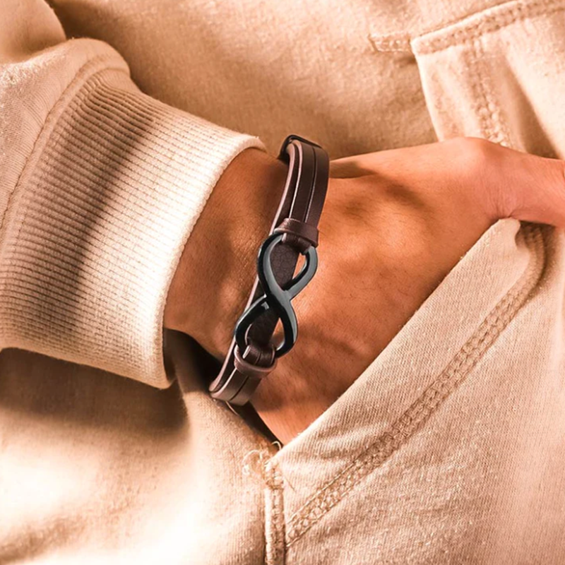 Men's braided black leather bracelet with stainless steel clasp, a stylish masculine wristband.