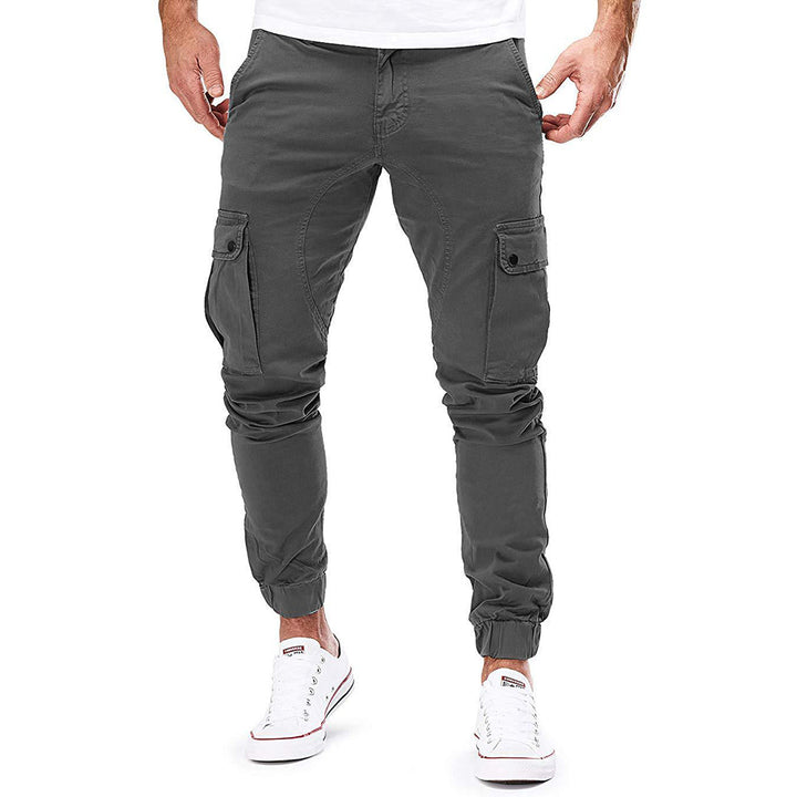 Men's casual cargo trousers in a relaxed fit, showing multiple utility pockets on the thighs and sides.