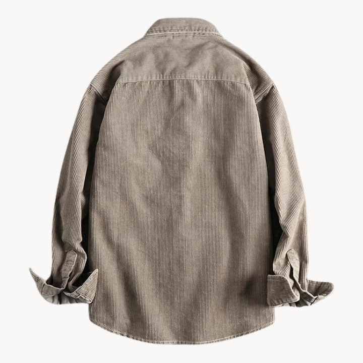 Close-up of the textured corduroy fabric on a men's long sleeve collared shirt, ideal for winter