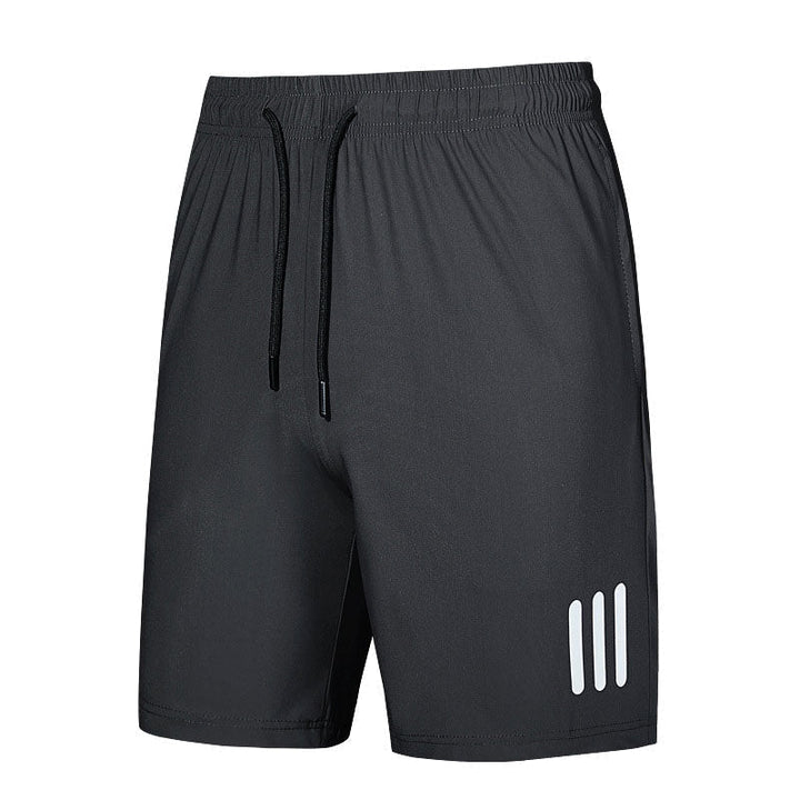 Detail of the polyester fabric on men's sports shorts, emphasizing its lightweight and quick-dry properties.