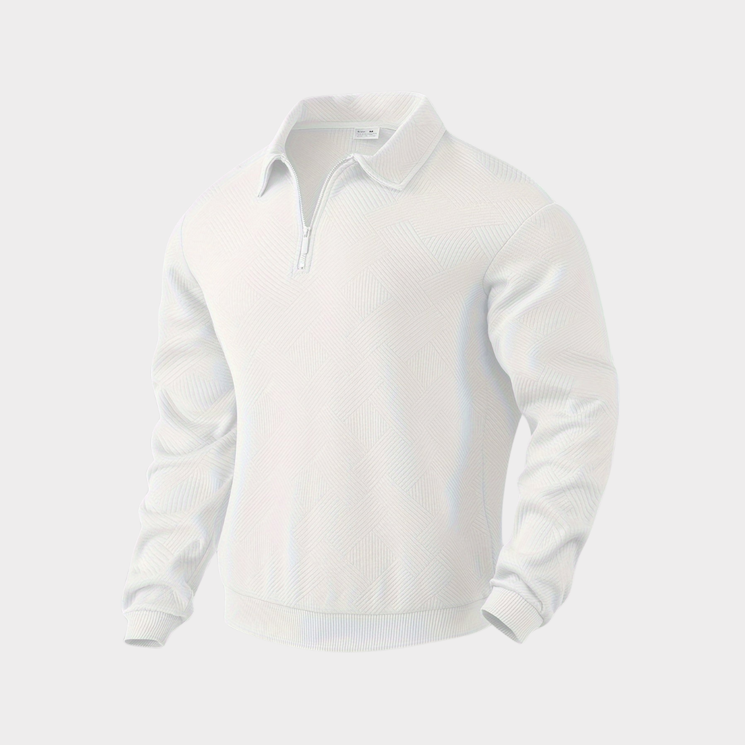 Heap of folded men's casual textured half-zip pullovers in assorted colors, retail display