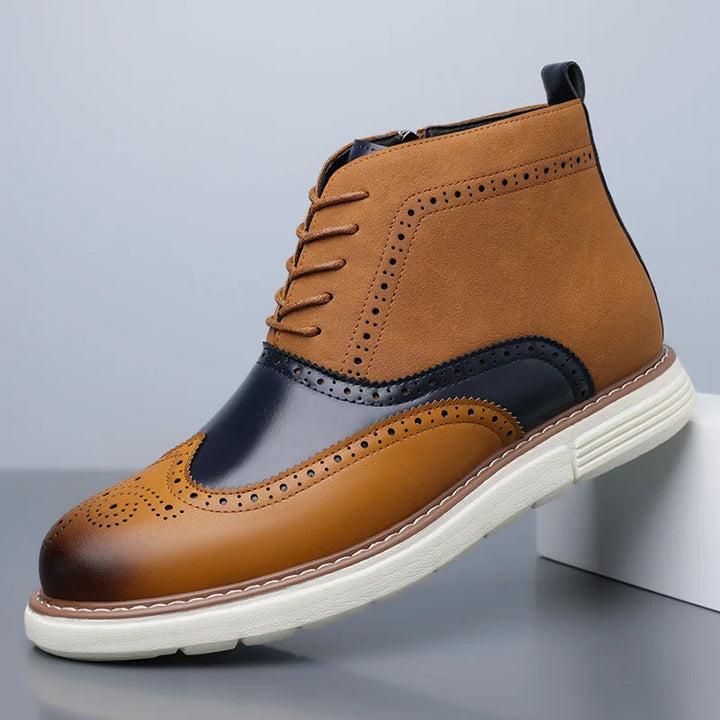 Close-up of the brogue detailing on men's leather boots, highlighting craftsmanship.