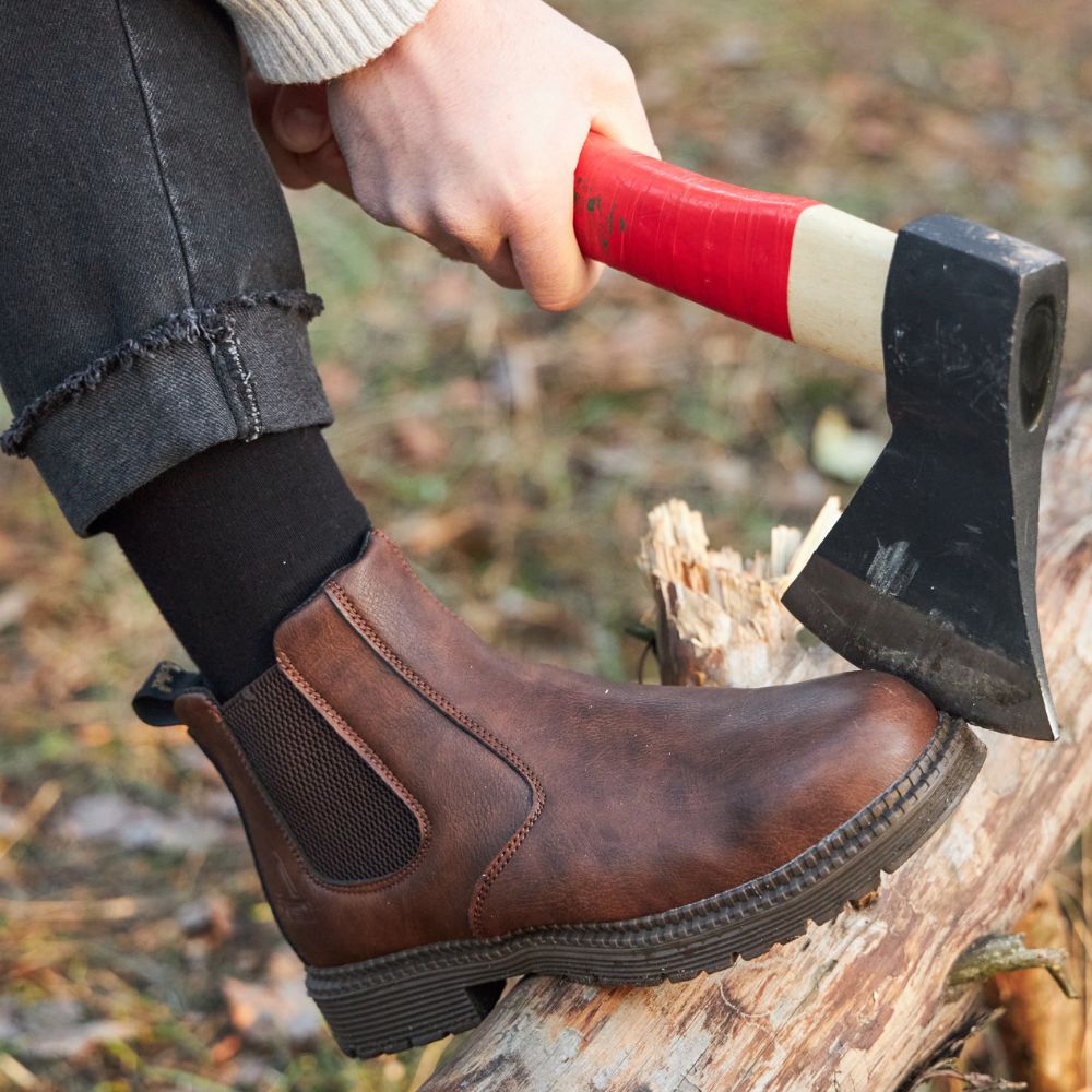 Side profile of men's brown comfort fit leather Chelsea boot with durable sole, ideal for men's footwear