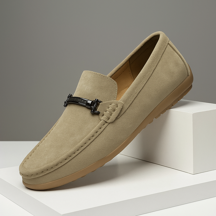 Close-up of a men's navy blue suede loafer, highlighting the soft texture and comfortable design