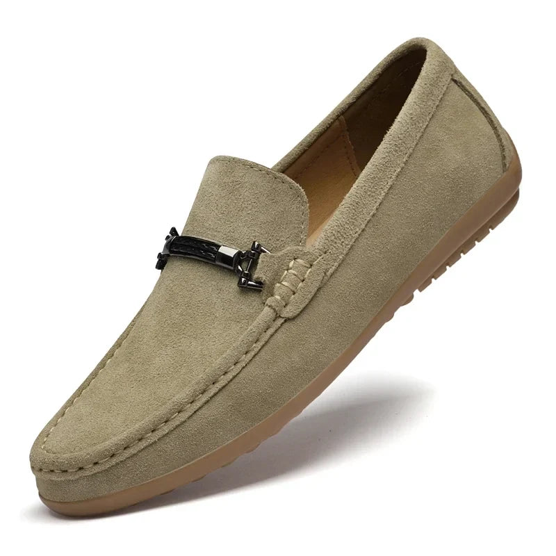 Detail of the stitching on a men's navy suede comfort loafer, highlighting craftsmanship