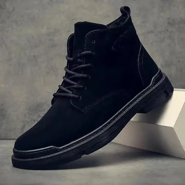 Close-up of men's classic suede leather boots, highlighting texture and lace details for men's fashion.