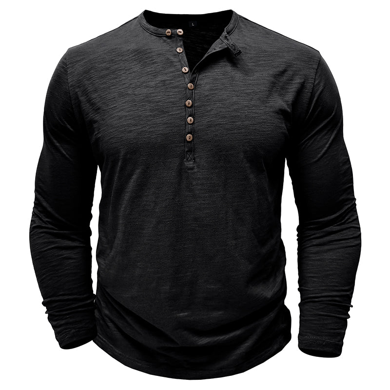 Close-up of the cuff detail on a men's classic henley shirt.