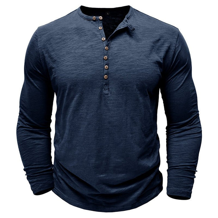 Three-quarter view of a men's long-sleeve henley, highlighting its fit.