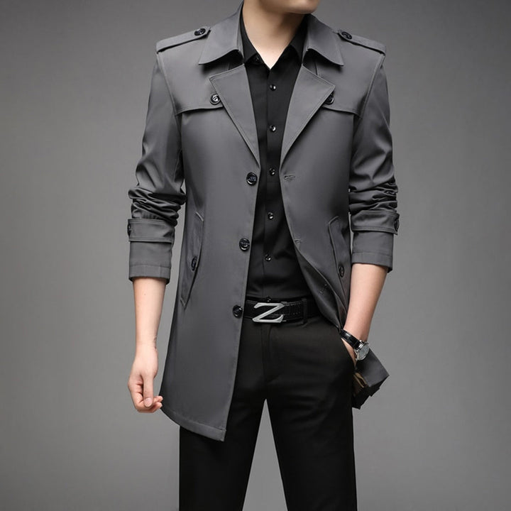 Close-up of the fabric texture on a men's lightweight single breasted trench coat, mens fashion.