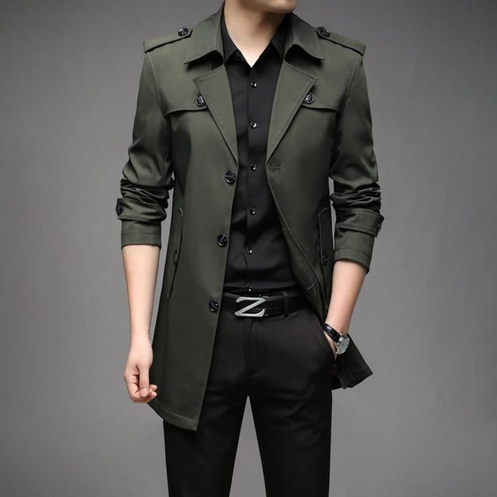 Full shot of a man wearing a smart, single-breasted, lightweight trench coat as outerwear.