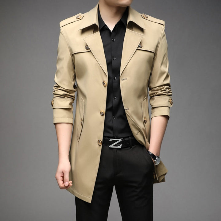 Detailed view of the lapel and Button closure on a men's single breated lightweight trench coat. mens fashion.