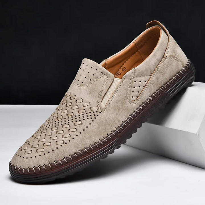 Dark blue men's slip-on loafers, elegant and comfortable footwear for a refined look.