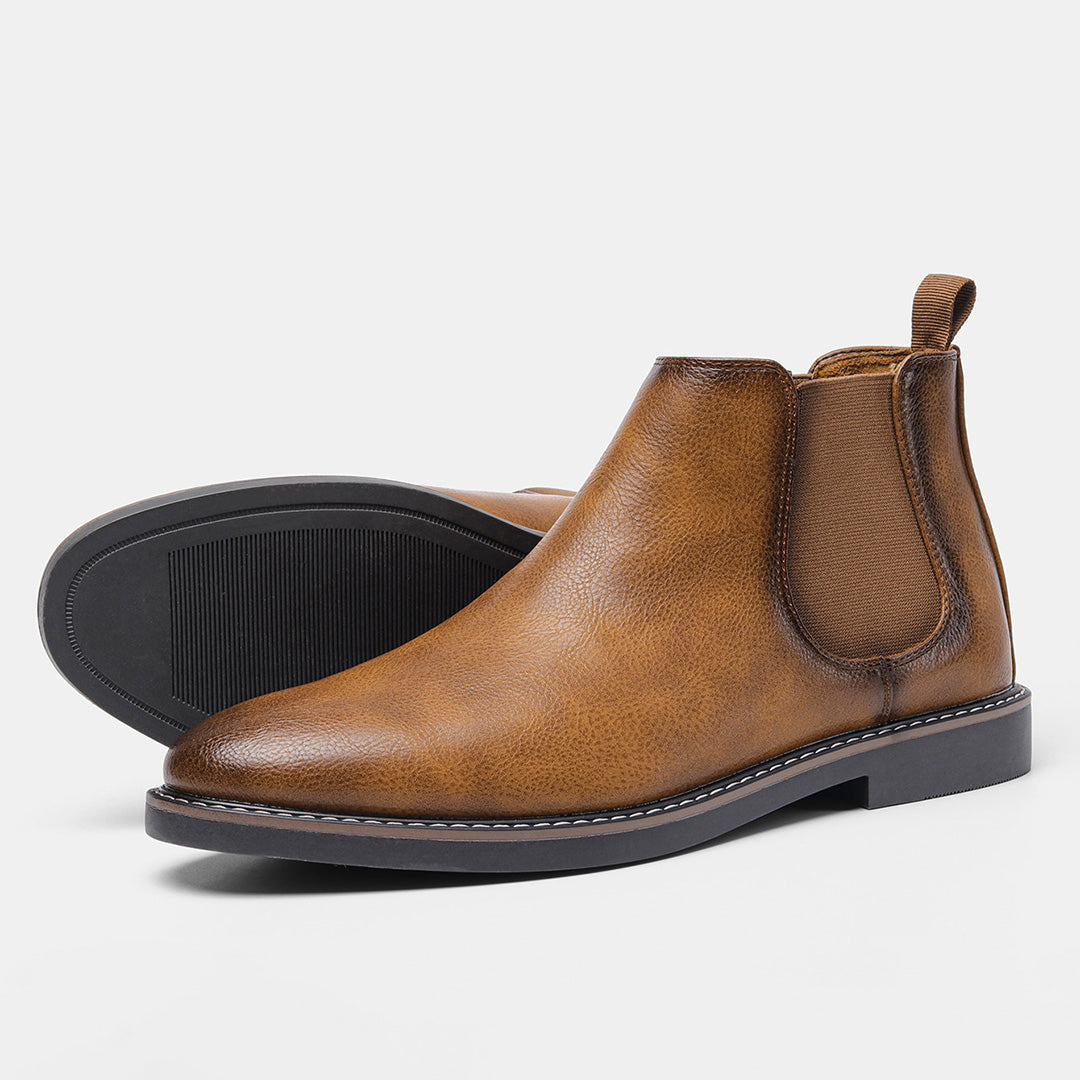Men's pull-on Chelsea boots in polished black leather, a staple in men's footwear