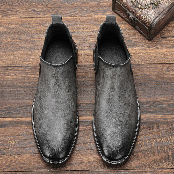 Array of men's Chelsea boots in black, brown, and tan, for various style preferences
