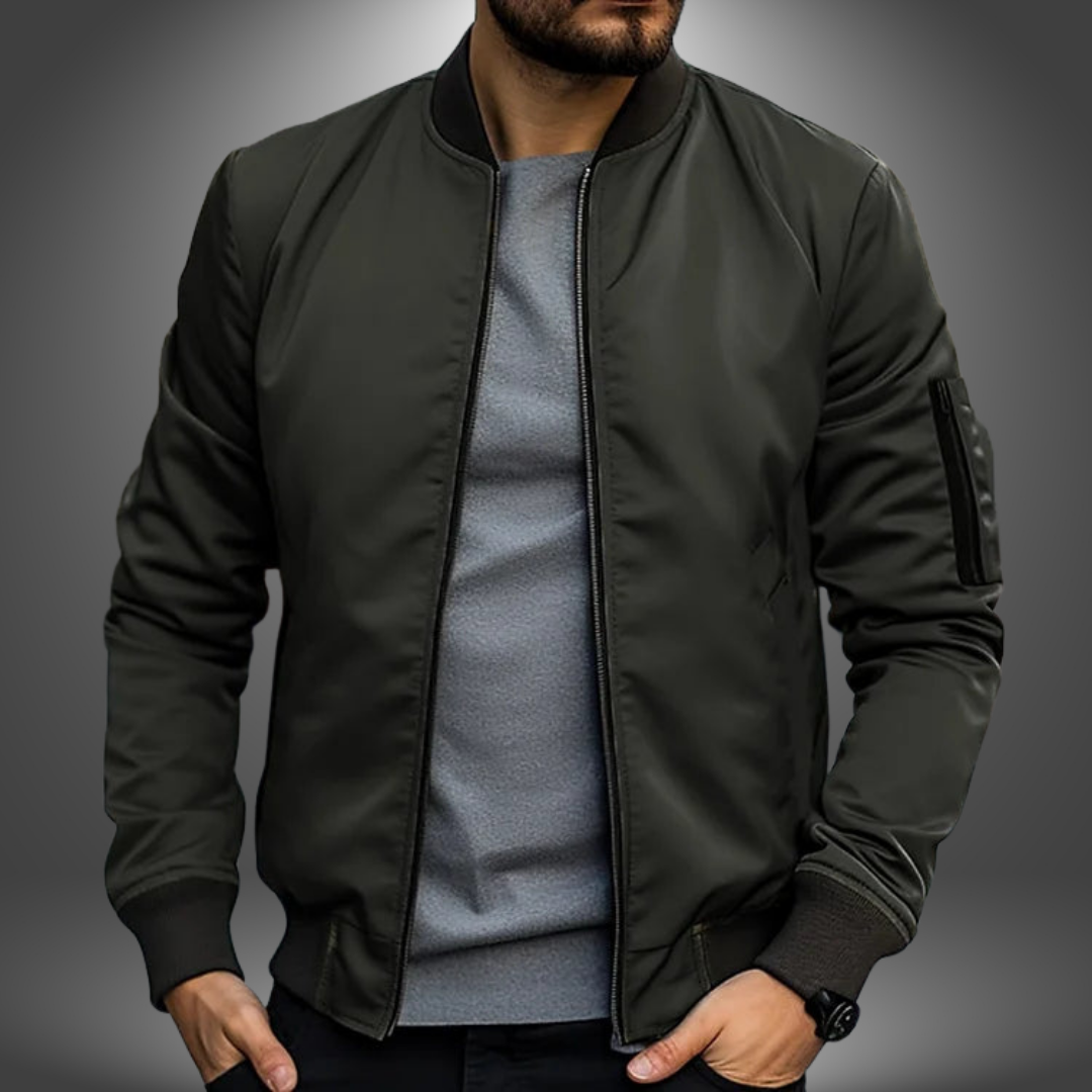 Man wearing a classic windproof bomber jacket in a casual setting. Perfect mid-season outerwear for men.