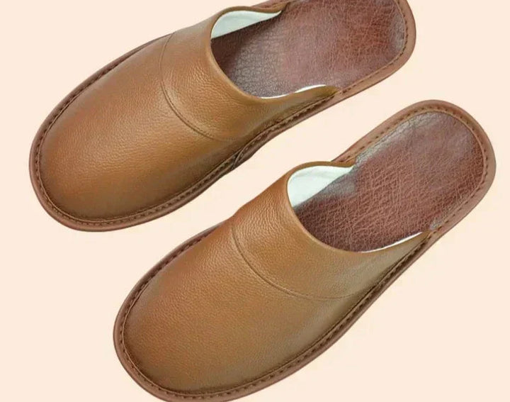 Side view of a men's slip-on slipper, showcasing easy wear design and comfortable indoor footwear.