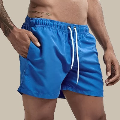 Classic men's drawstring swim trunks, offering comfort and timeless summer style for beach.