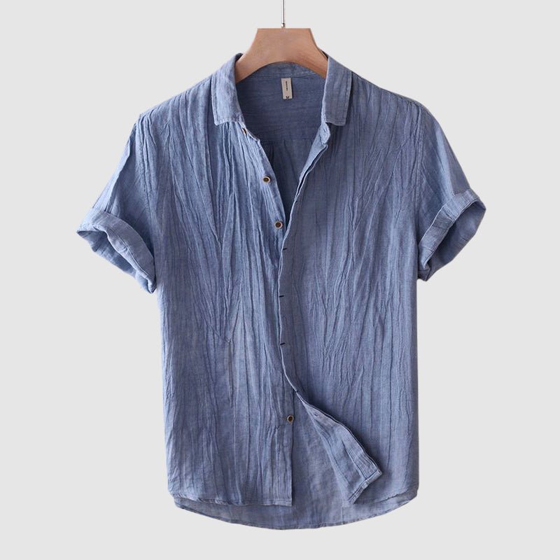 Textured men's short sleeve button-down shirt for a casual summer look. Comfortable, relaxed fit top for warm weather.