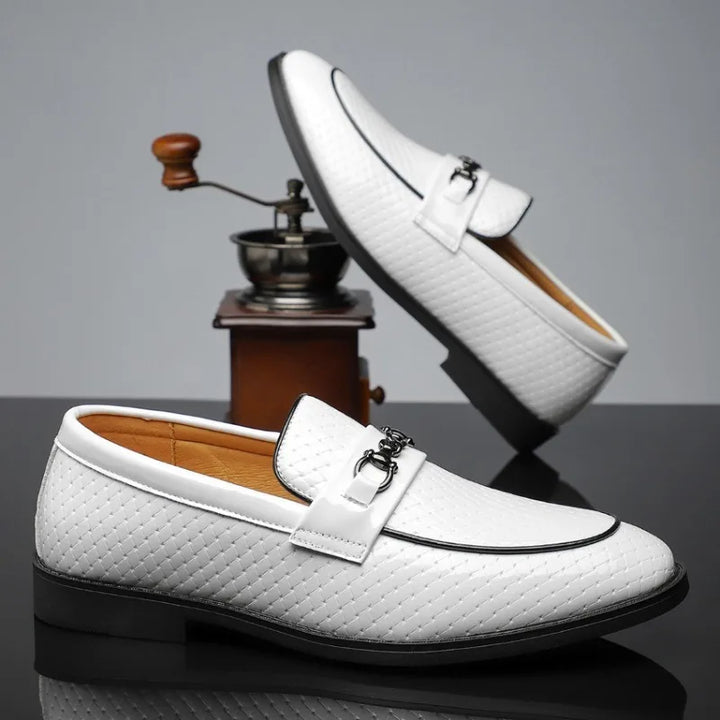 Embossed leather bit loafers for men, featuring unique texture and a classic loafer silhouette.