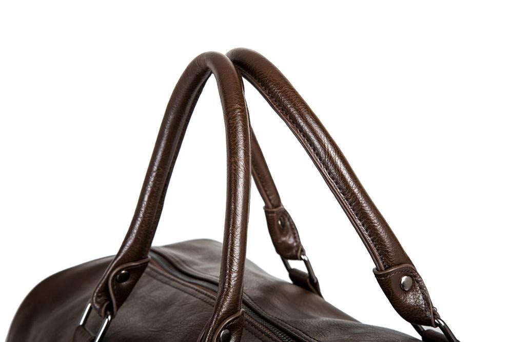 Practical men's faux leather duffel bag, spacious luggage for travel gear.