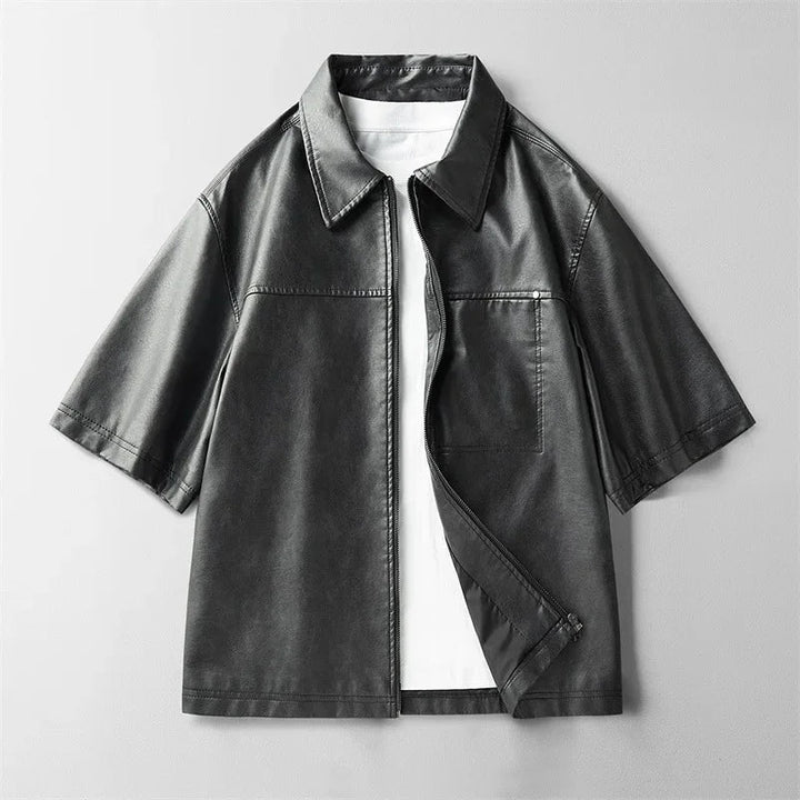 Front view of a men's coffee genuine leather short-sleeve shirt with prominent button detailing.