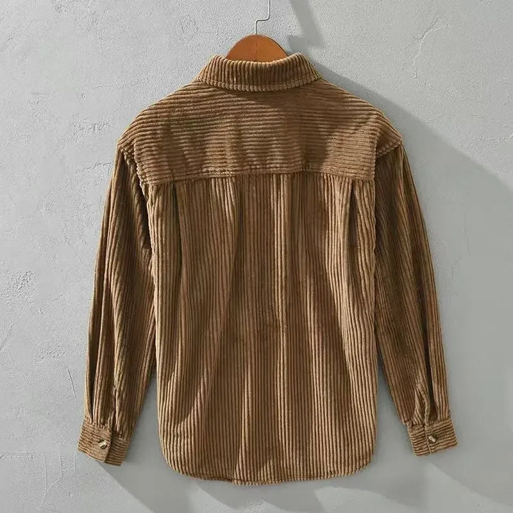 Flat lay of men's brown ribbed corduroy overshirt, utility shirt with front pockets