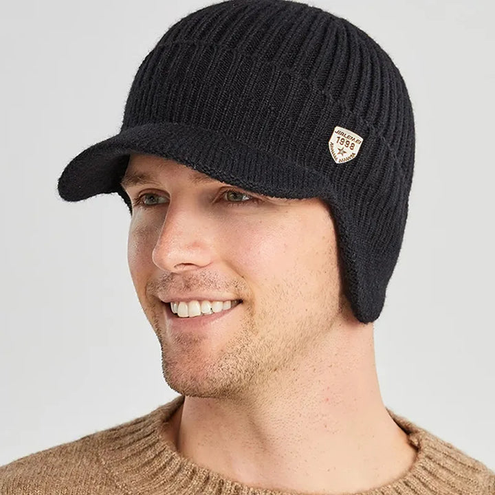 Men's knitted beanie with ear flaps, perfect for winter warmth and cold weather outdoor activities.