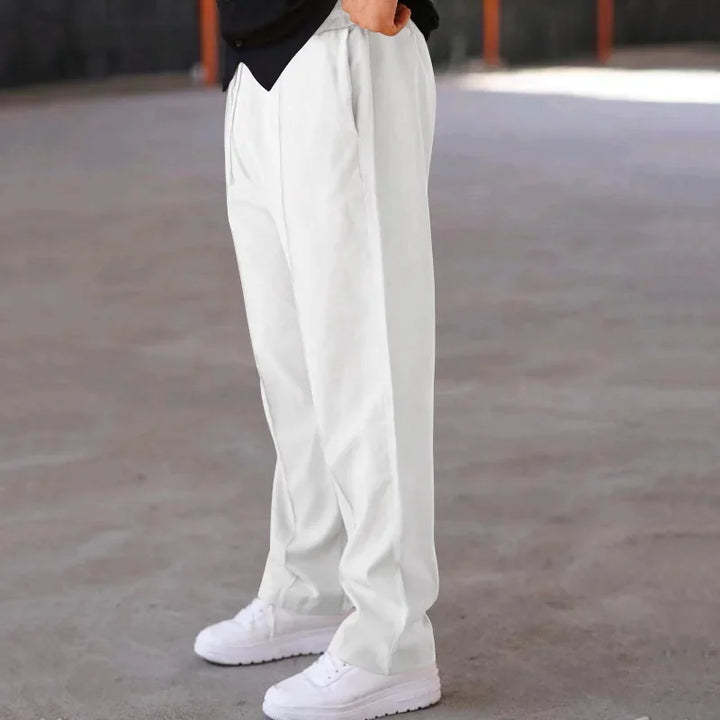 Model wearing men's loose-fit formal trousers, demonstrating the comfortable and elegant fit.