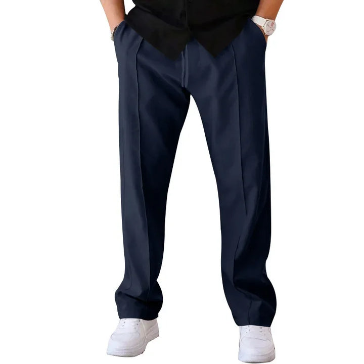 Uncreased men's loose-fit formal trousers, highlighting the smooth fabric and comfortable feel.