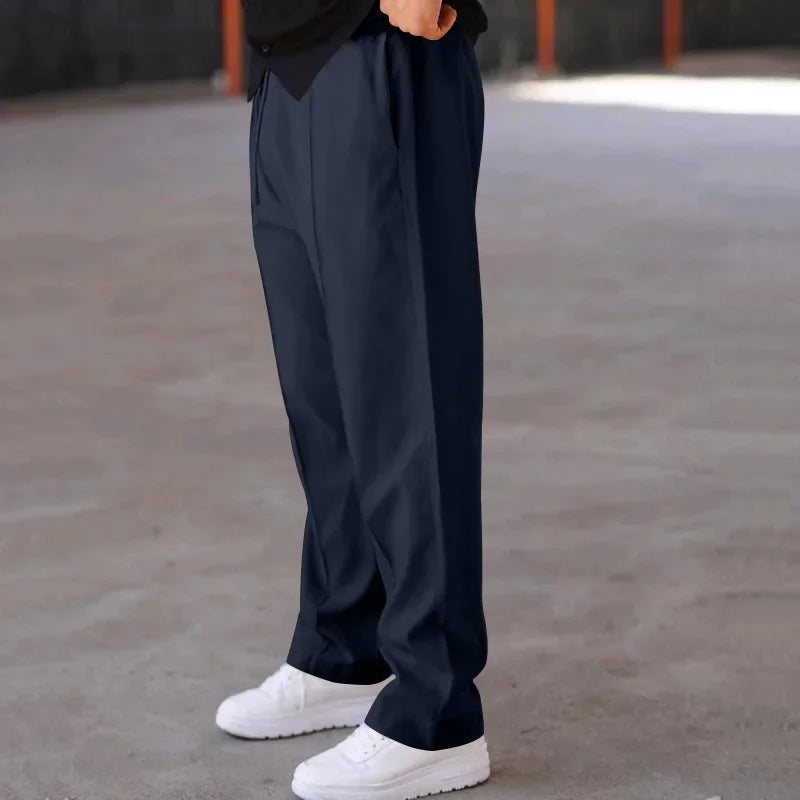Classic black men's loose-fit formal trousers, offering comfort and sophisticated style.
