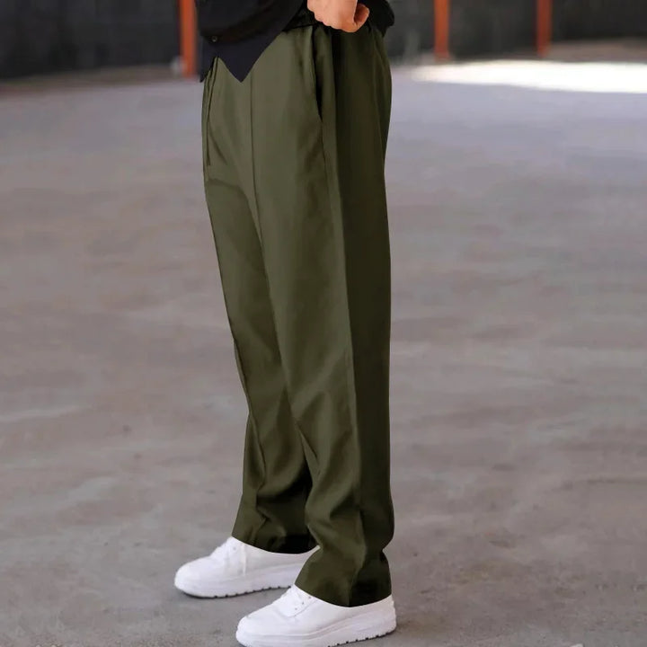 Rear view of men's loose-fit formal trousers with well-placed pockets, great for business attire.