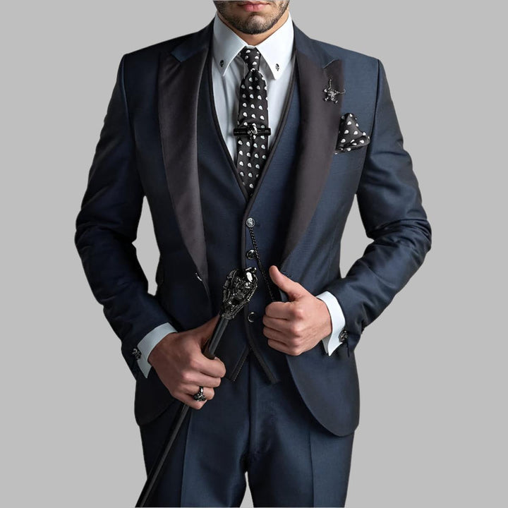 Close-up of the fabric texture of a men's three piece formalwear suit, showing luxury detail.