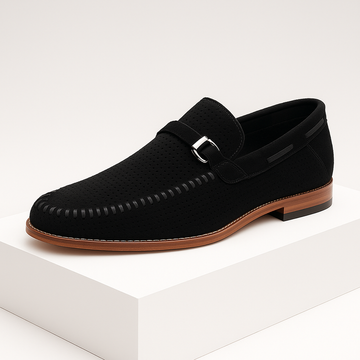 Men's gray suede loafers with a distinctive perforated pattern, offering both comfort and sophisticated footwear style.