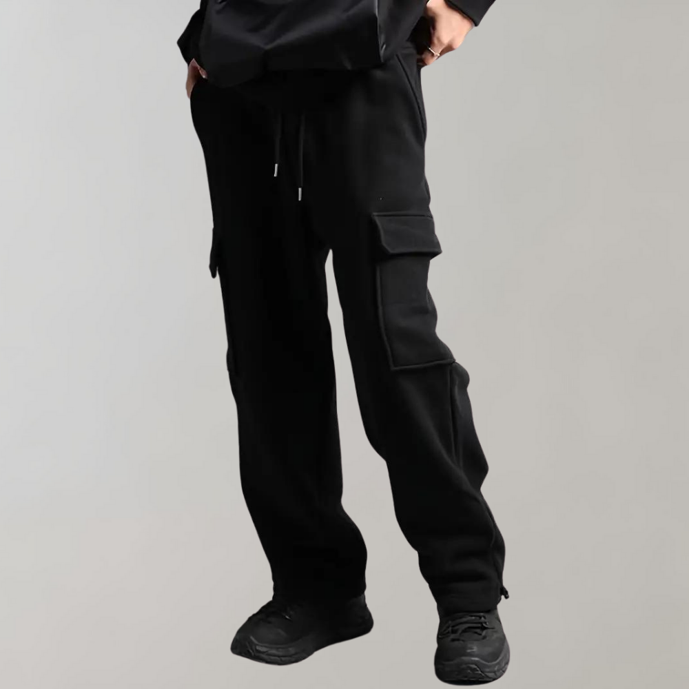 Detail of the waistband and pocket closure on men's relaxed fit cargo pants, offering utility