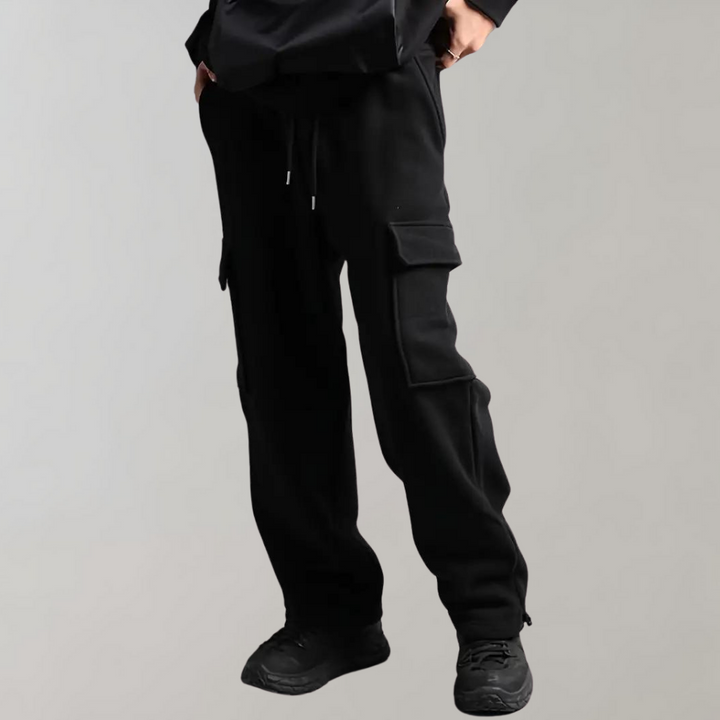 Detail of the waistband and pocket closure on men's relaxed fit cargo pants, offering utility